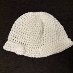 Crocheted White beautiful beanie with a flower